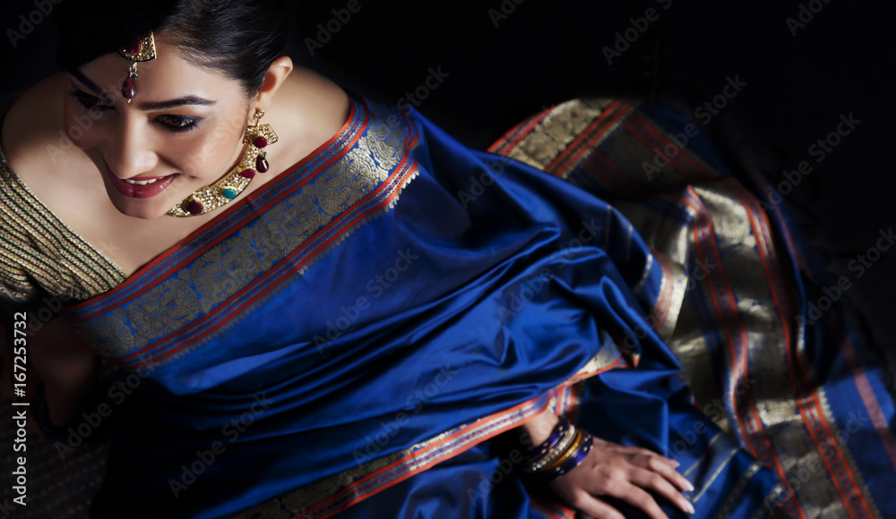 Woman in a blue saree